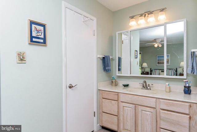 bathroom featuring ceiling fan and vanity