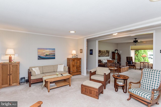 carpeted living room featuring crown molding and ceiling fan