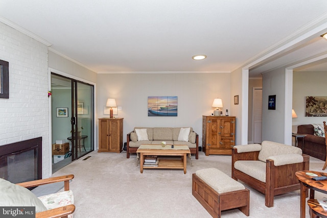 carpeted living room with ornamental molding and a fireplace