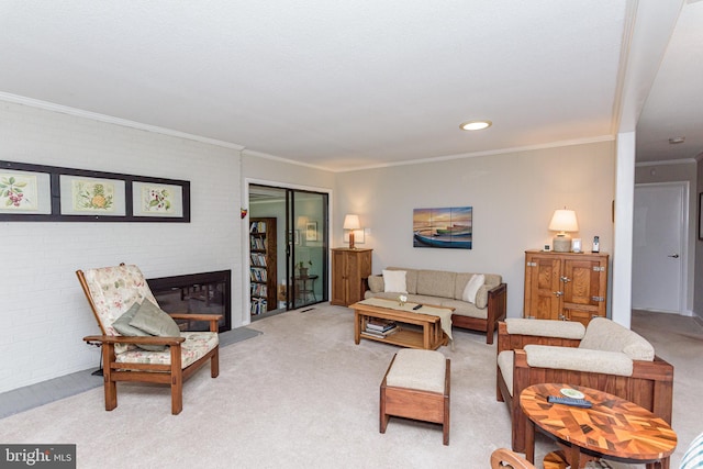 carpeted living room with a brick fireplace and crown molding