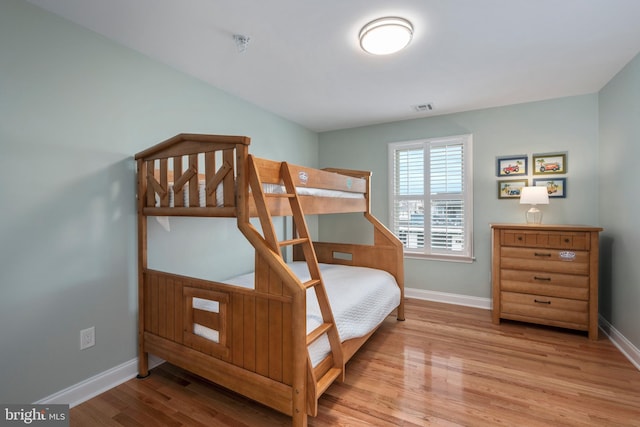 bedroom with light wood-type flooring