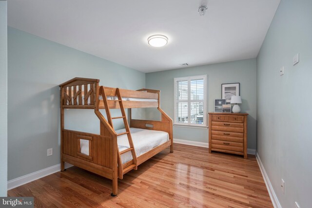 bedroom with light wood-type flooring