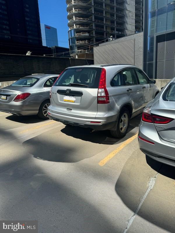 uncovered parking lot with a city view