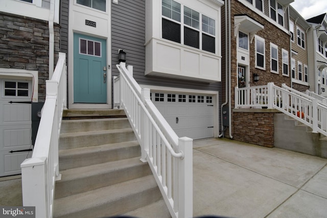 view of exterior entry featuring a garage