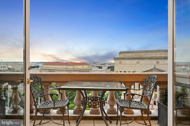 view of balcony at dusk