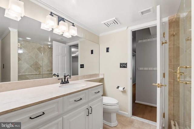 bathroom with ornamental molding, visible vents, a shower stall, and vanity