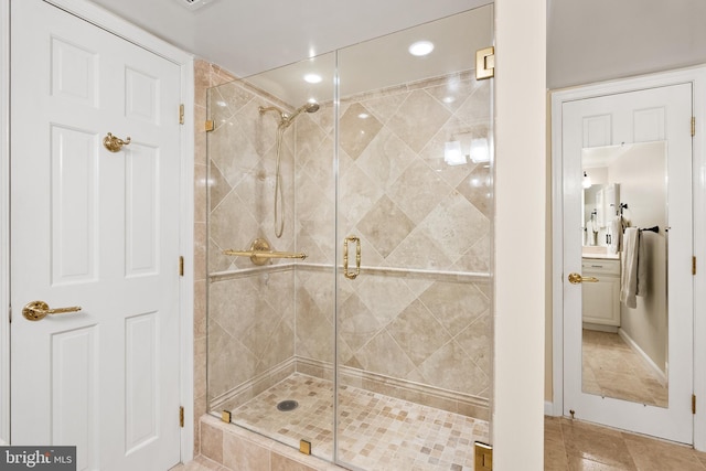 bathroom featuring recessed lighting and a shower stall