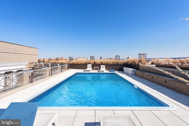 view of pool featuring a patio area and a fenced in pool