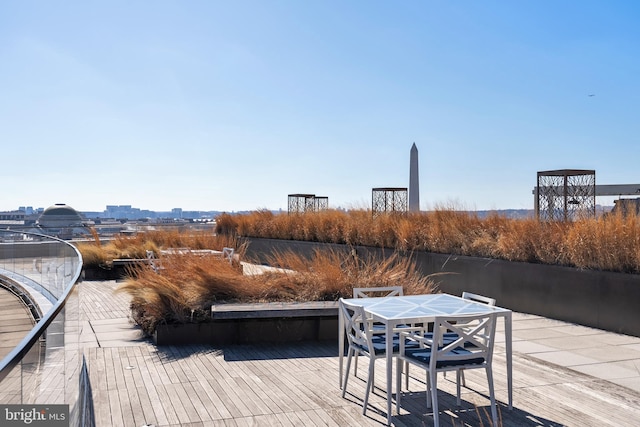 wooden deck with outdoor dining space