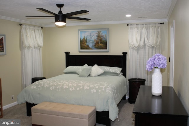 carpeted bedroom with crown molding, a textured ceiling, and ceiling fan