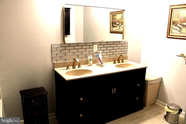 bathroom featuring tile patterned floors, vanity, and decorative backsplash