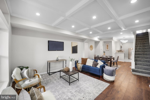 living room featuring coffered ceiling, beam ceiling, dark wood-type flooring, and ornamental molding