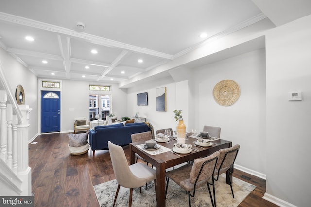 dining room with coffered ceiling, beam ceiling, dark wood-type flooring, and crown molding