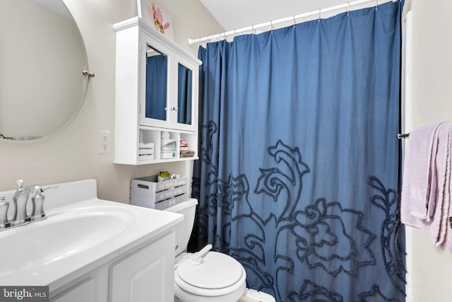 bathroom with vanity, toilet, and a shower with shower curtain