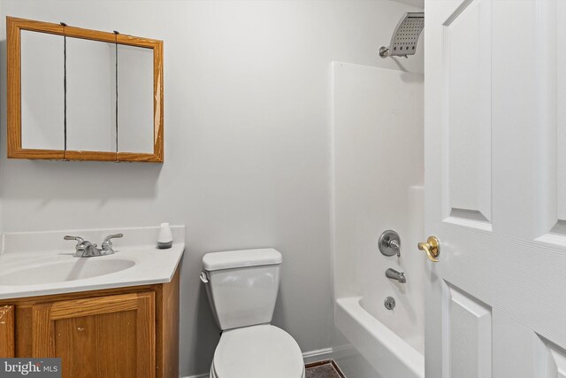 full bathroom with washtub / shower combination, vanity, and toilet