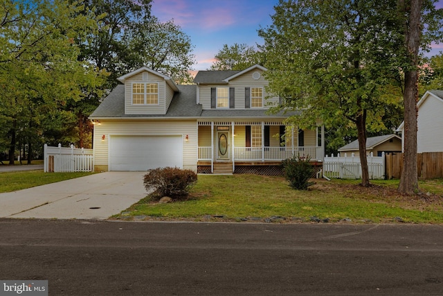 view of front of house with a garage and a porch