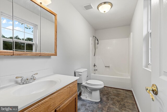 full bathroom with vanity, bathtub / shower combination, and toilet