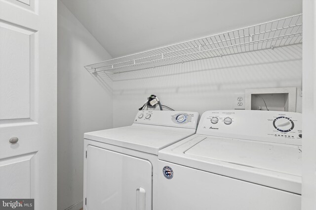 clothes washing area featuring washing machine and dryer