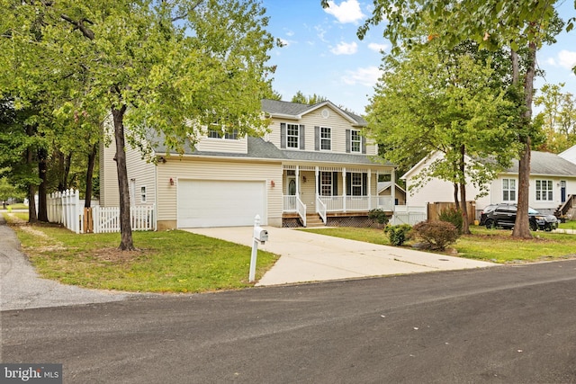 view of front facade with a garage and covered porch