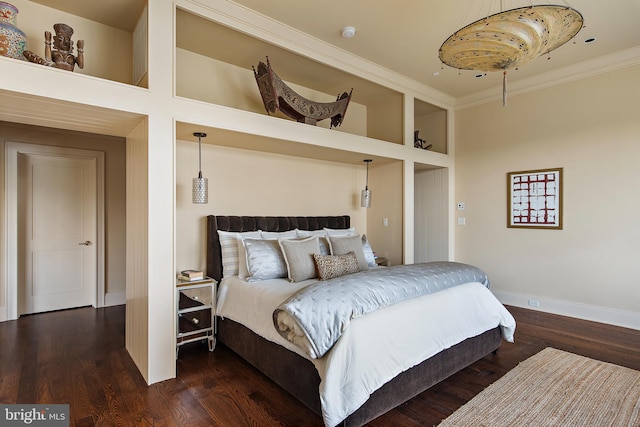 bedroom featuring ornamental molding, dark wood-type flooring, and a high ceiling