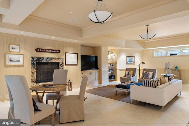 interior space featuring crown molding and a fireplace