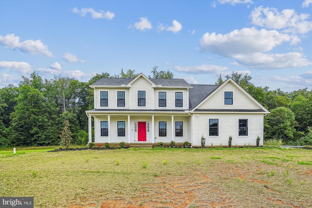 view of front of home featuring a front yard and a porch