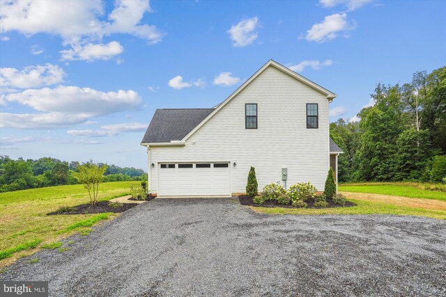 view of side of home featuring a lawn