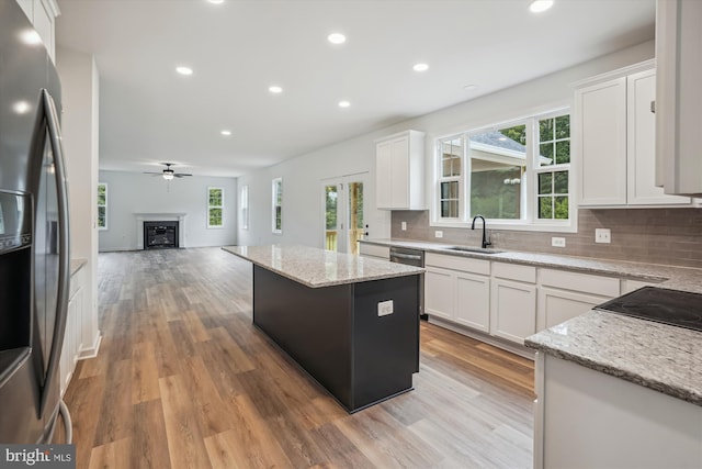 LOTD Beaver Dam Road, Jeffersonton, VA 22724 - kitchen featuring backsplash, open floor plan, white cabinets, stainless steel appliances, and a sink