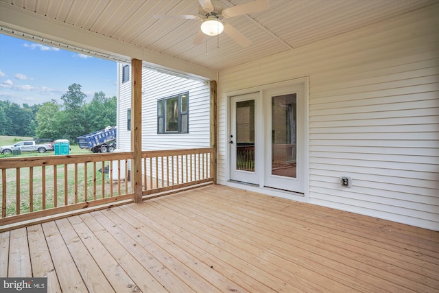 wooden deck featuring ceiling fan