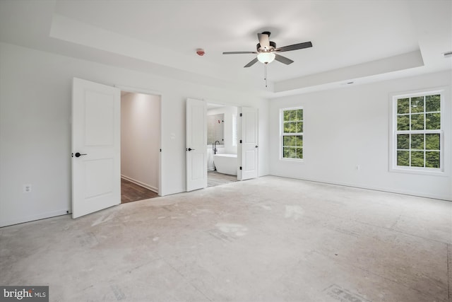 LOTD Beaver Dam Road, Jeffersonton, VA 22724 - unfurnished bedroom featuring connected bathroom, baseboards, and a tray ceiling