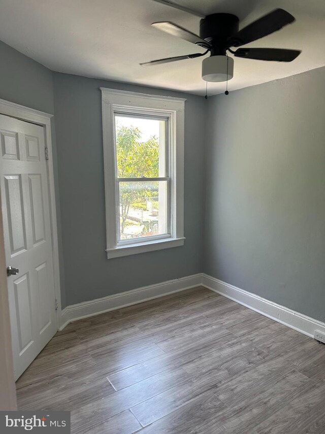 spare room featuring ceiling fan and light hardwood / wood-style floors