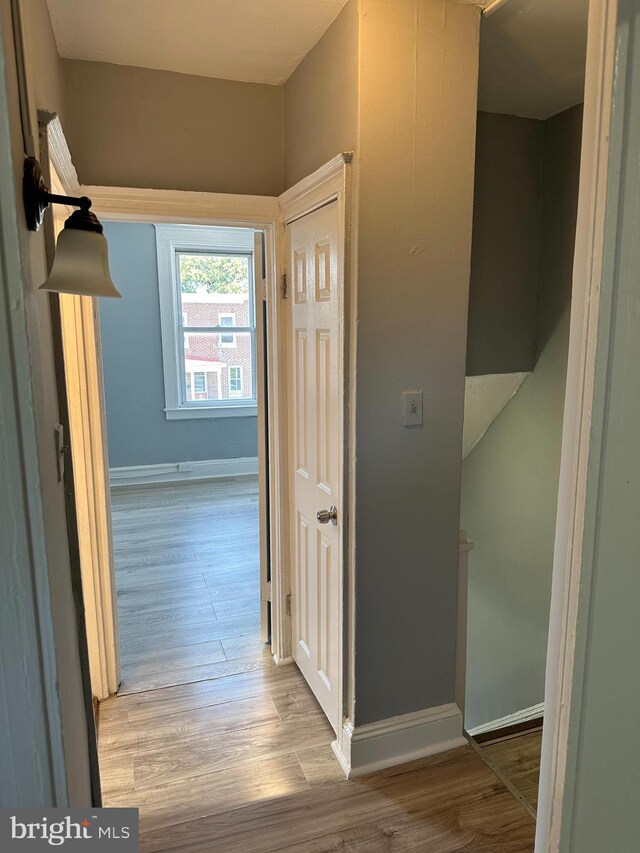 hall with light hardwood / wood-style floors