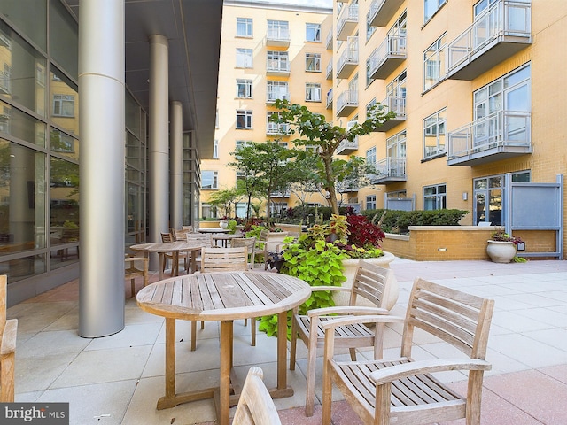 view of patio with a balcony