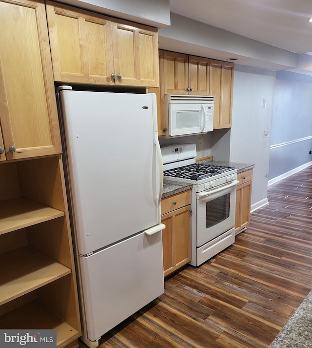 kitchen featuring white appliances, light brown cabinetry, and dark hardwood / wood-style floors