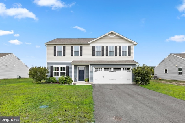 front facade with a front yard and a garage