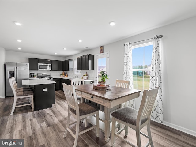 dining area with hardwood / wood-style floors