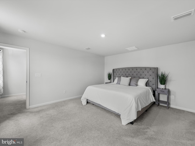 bedroom with light colored carpet