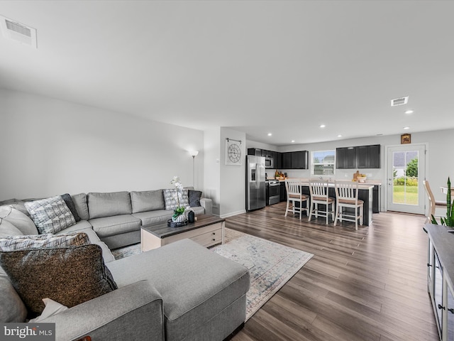 living room with dark wood-type flooring