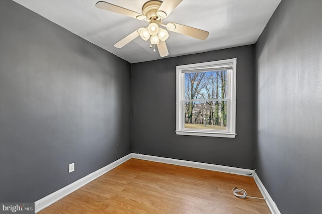 spare room featuring ceiling fan and light wood-type flooring