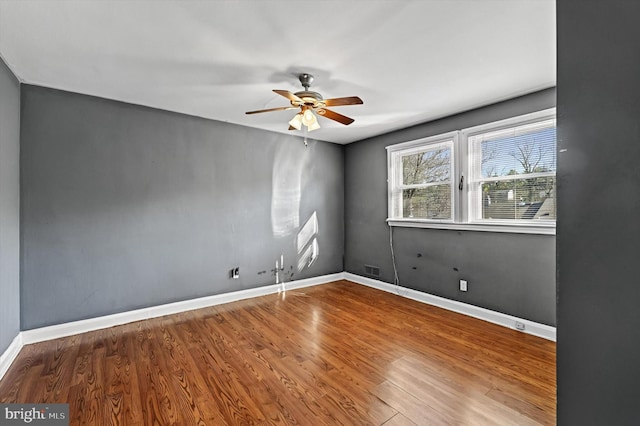 spare room featuring ceiling fan and wood-type flooring