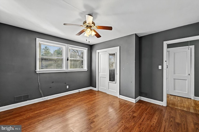 unfurnished bedroom featuring ceiling fan and hardwood / wood-style floors