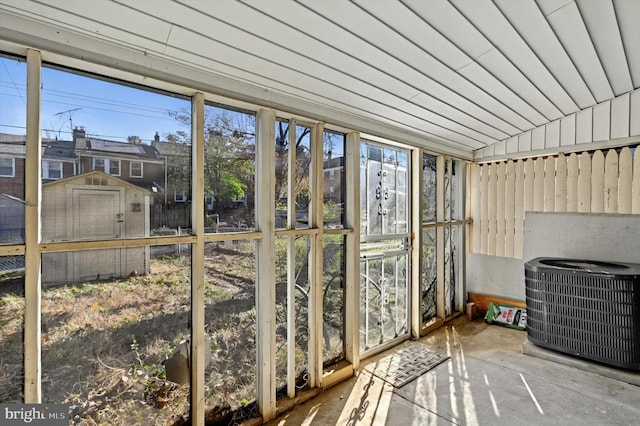 unfurnished sunroom with vaulted ceiling