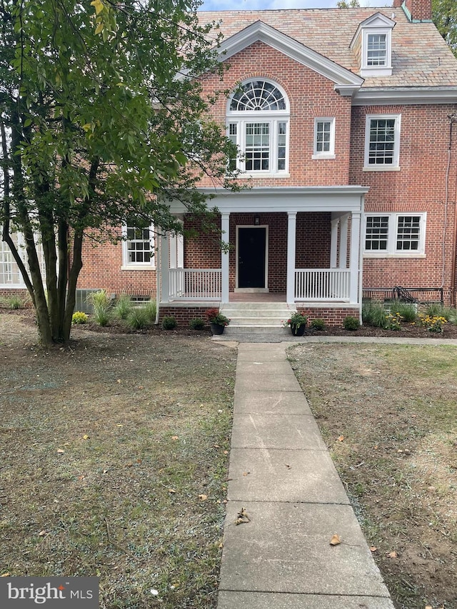 view of front of home with a front lawn and a porch