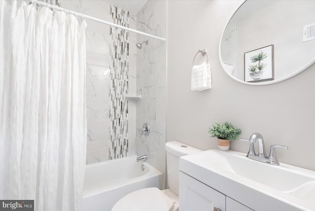 full bathroom featuring shower / bath combo, vanity, and toilet