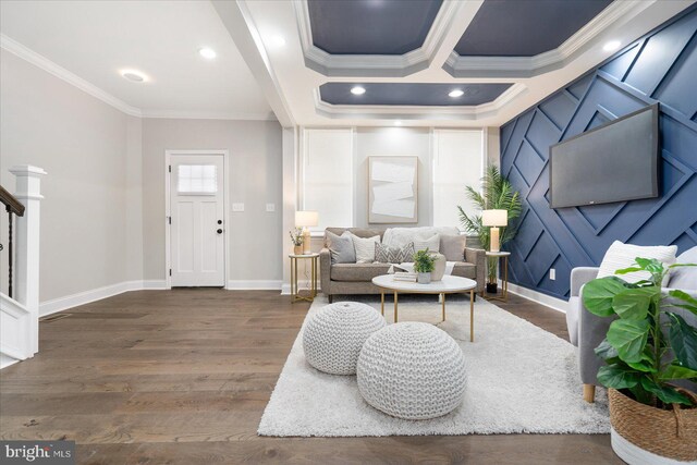 living room with crown molding and dark wood-type flooring