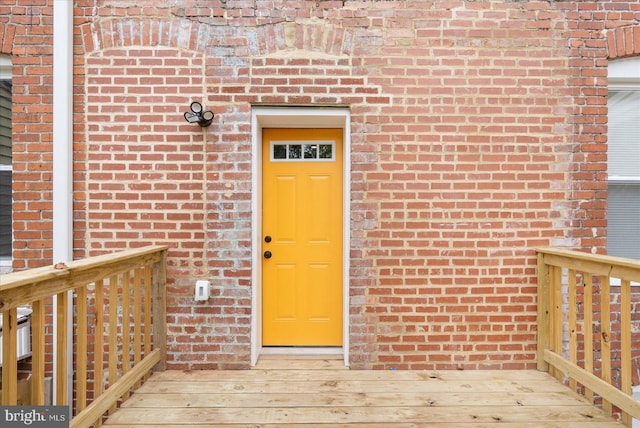 entrance to property with a wooden deck