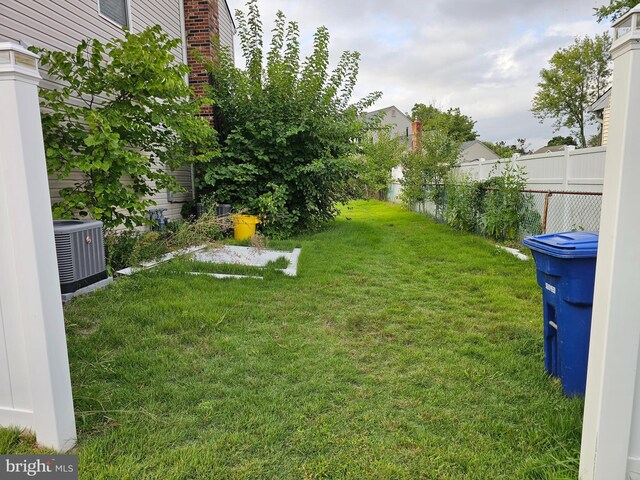 view of yard with central air condition unit