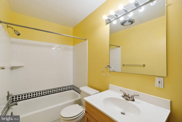 full bathroom with toilet, tiled shower / bath, and vanity