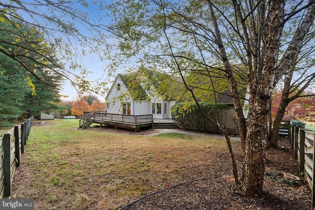 view of yard featuring a wooden deck