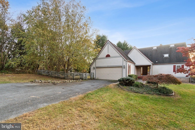 view of front facade featuring a front yard and a garage